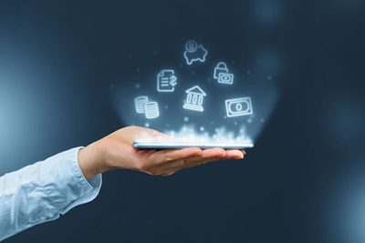 Person holds a smartphone with mobile banking icons projection